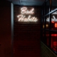 neon sign reads "bad habits"