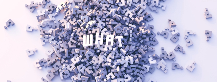 the word "what" on a pile of question marks for multiple choice question